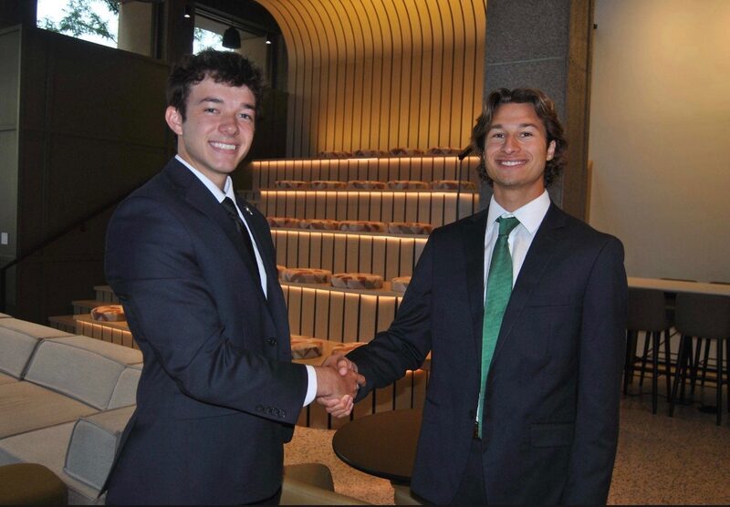 Two Legacy Point Solutions team members shaking hands after a business development meeting