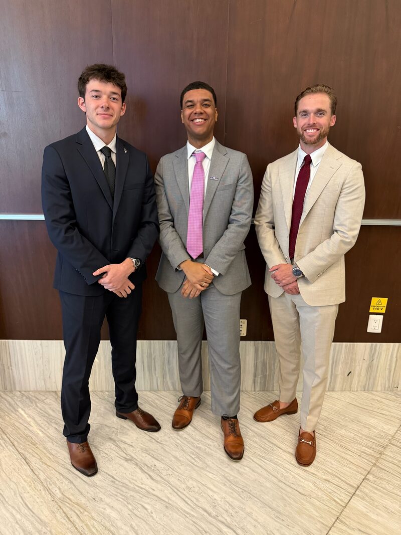 Three Legacy Point Solutions management trainees in business attire