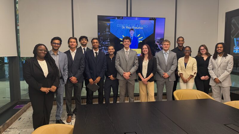 Legacy Point Solutions team members standing together in a modern conference room
